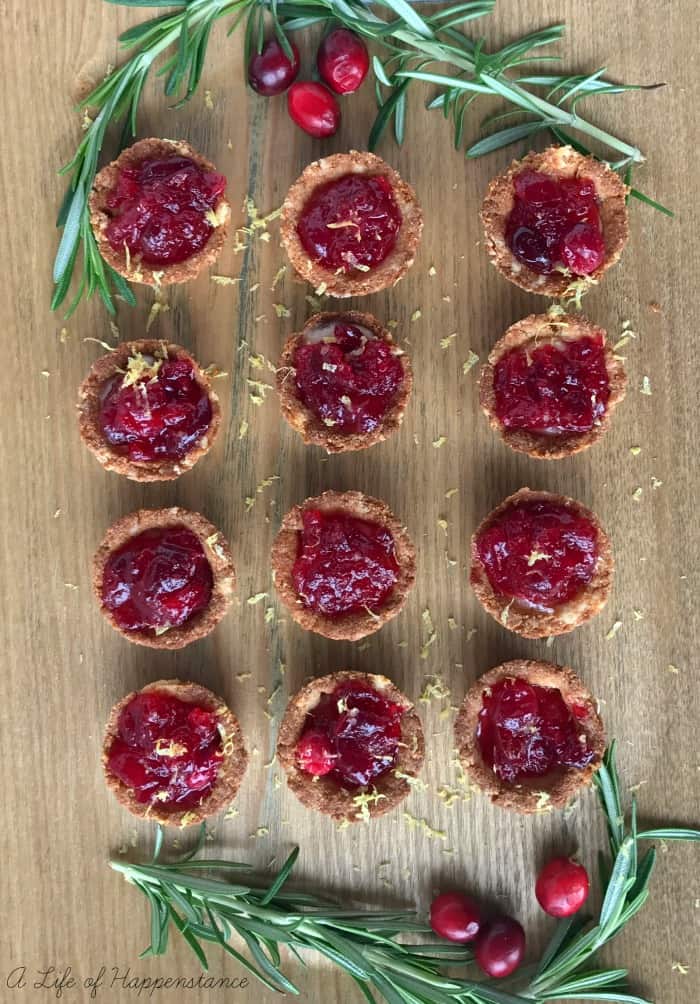 Tartlets on a wooden cutting board. 