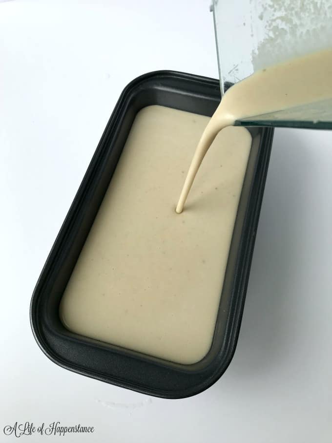 Dairy free vanilla cashew ice cream being poured into a loaf pan. 