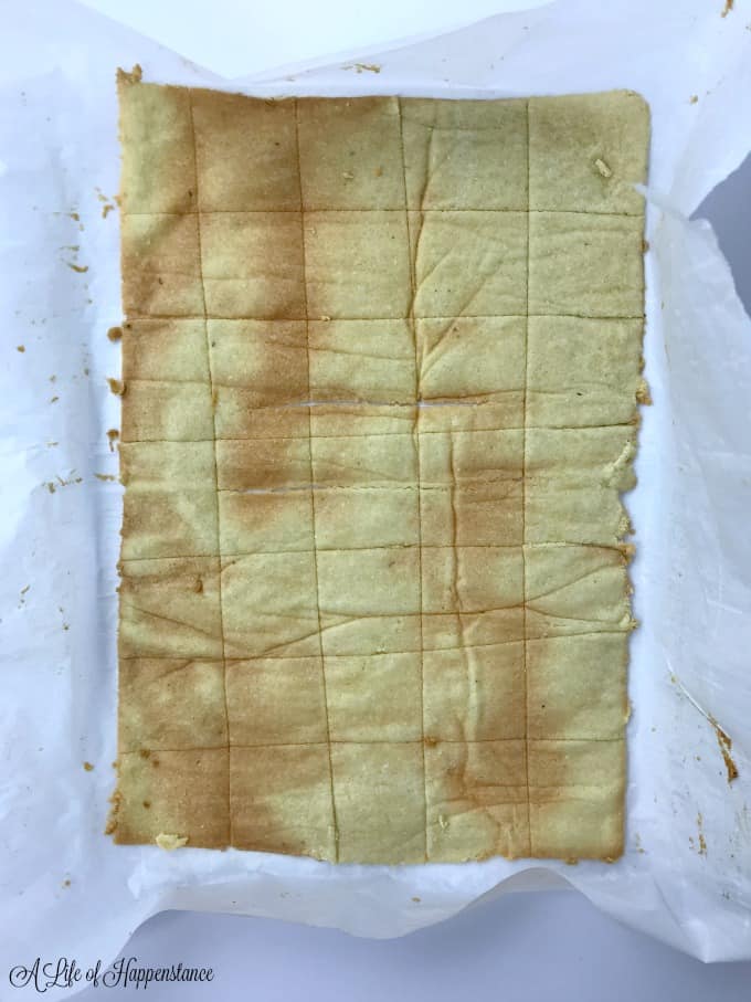 Baked crackers on parchment paper.