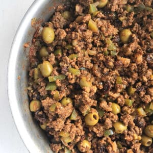 A skillet filled with picadillo.