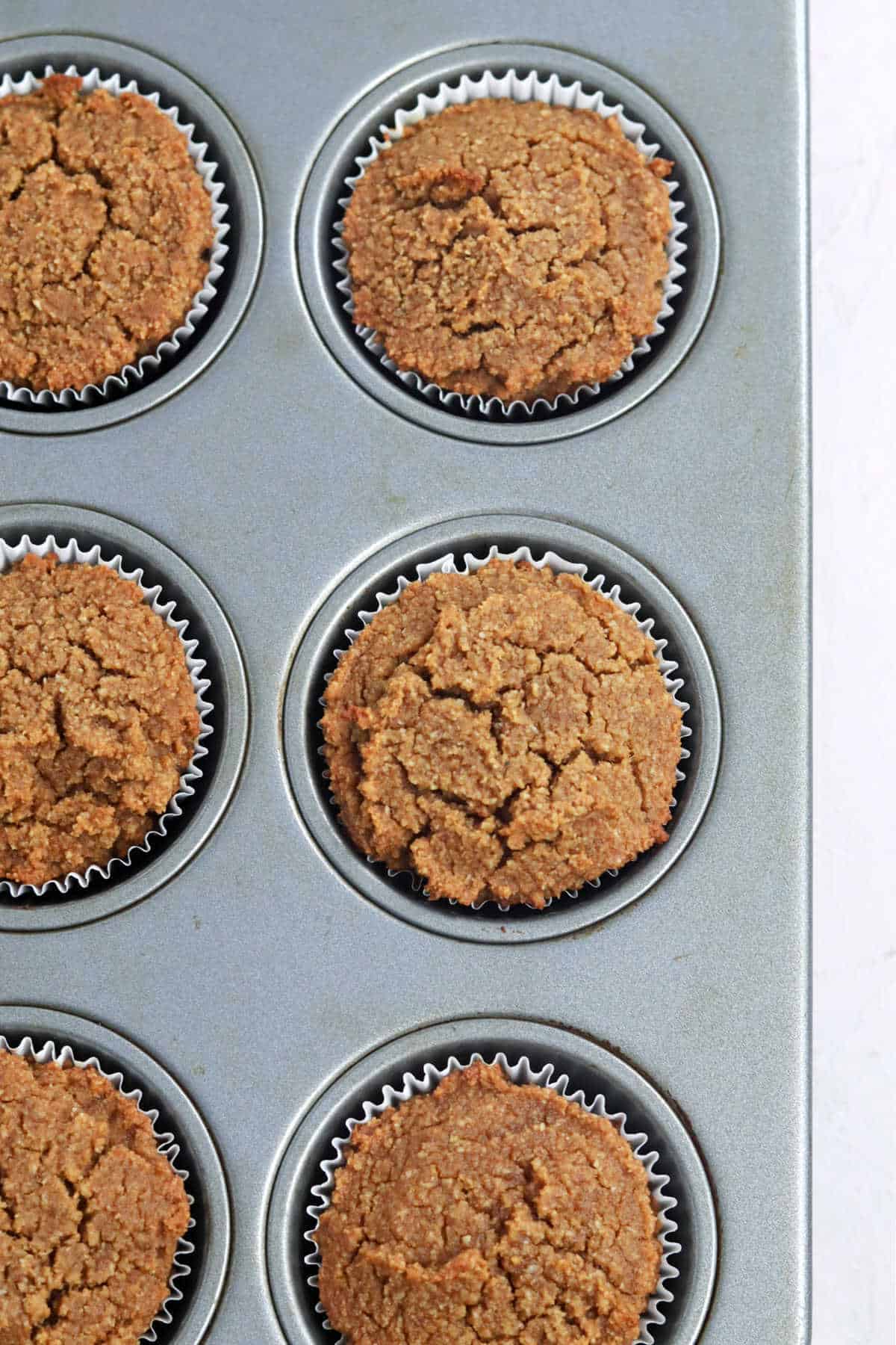 Perfectly baked cupcakes in a muffin tin.